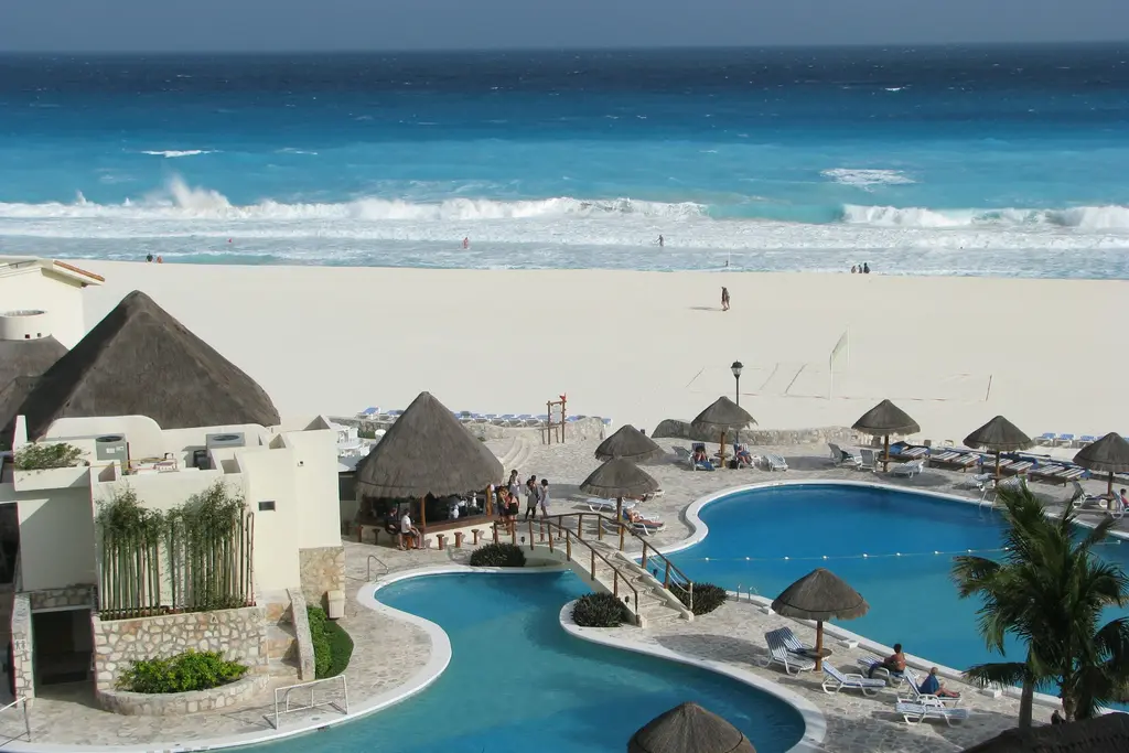 Pool and palapas in a Cancún community