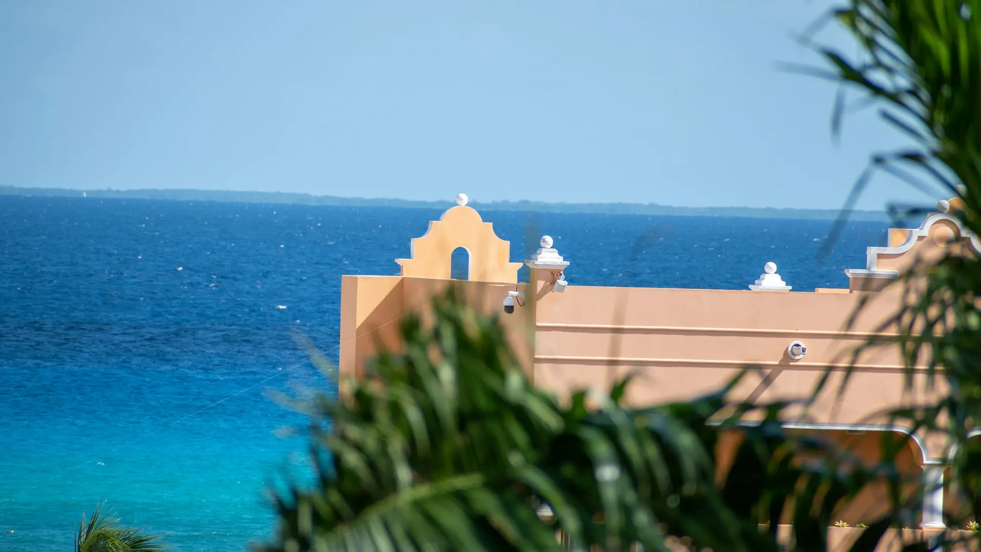 Homes with palm trees by the Caribbean in Playa del Carmen