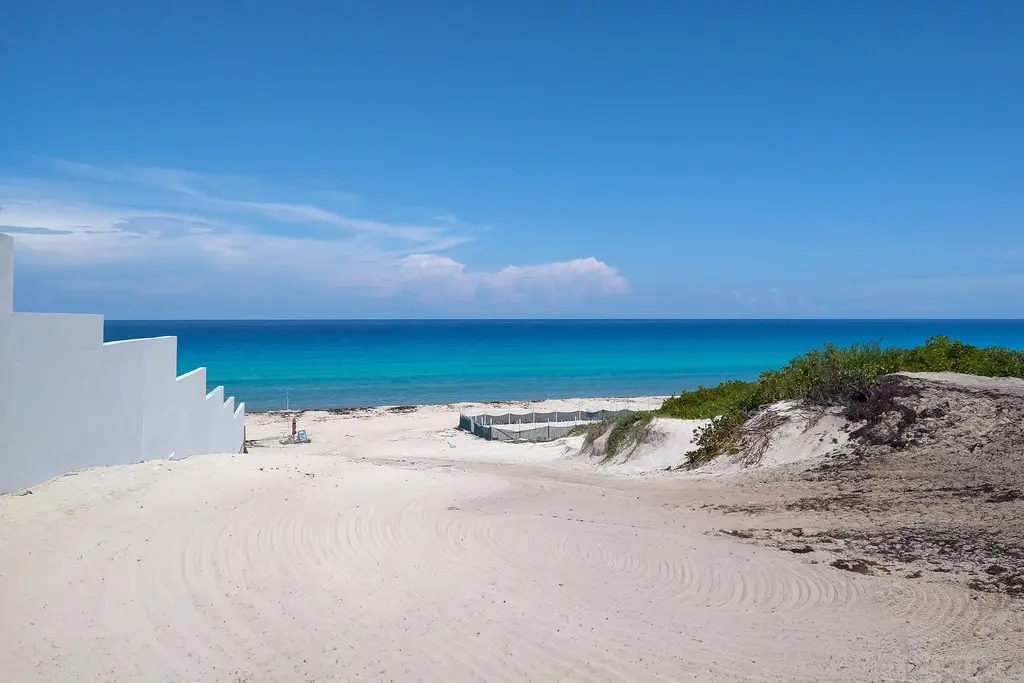 White steps leading down to the beach in the Cancún Hotel Zone