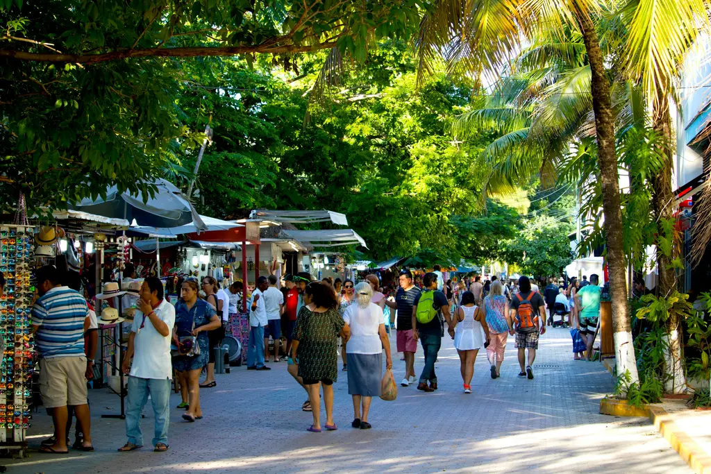 People walking along Fifth Avenue in Playa del Carmen