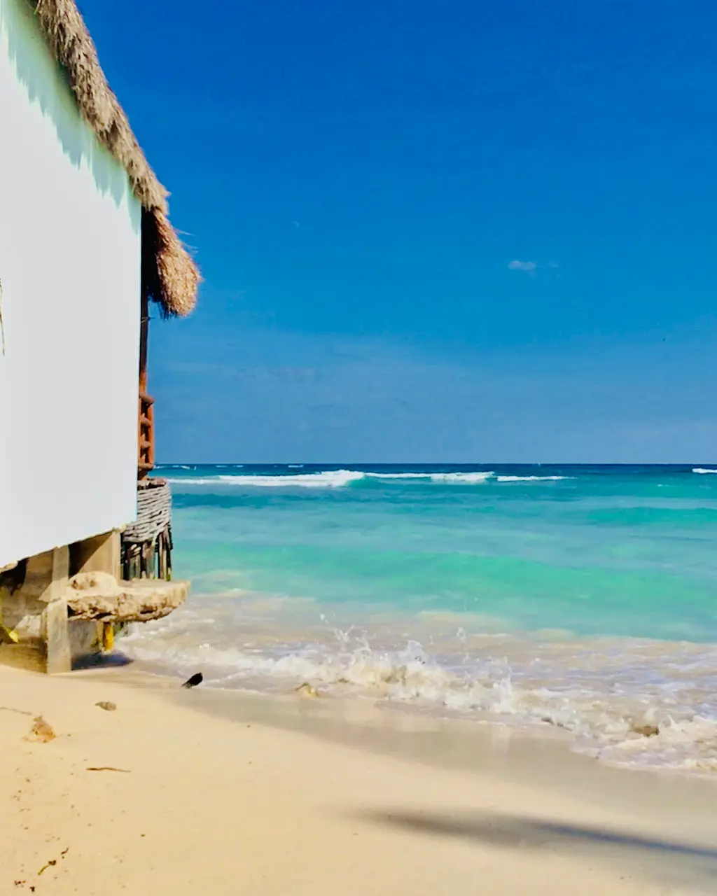 White wooden house on the beach in Playa del Carmen